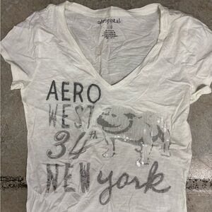 Vintage Y2K Aeropostale White V-Neck Graphic Tee with Silver Sequin Bull